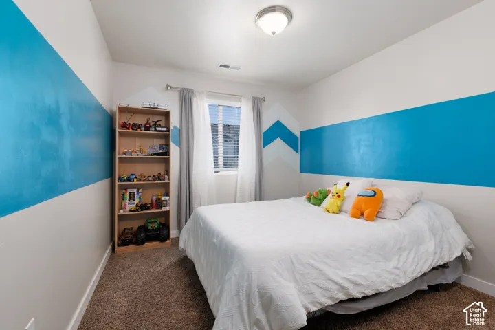 Wall-to-wall carpeting and painted accent walls