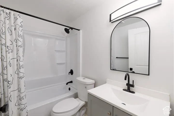 White shower and tub combination with matte black fixtures