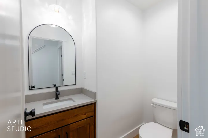 Stylish half bathroom near garage entrance