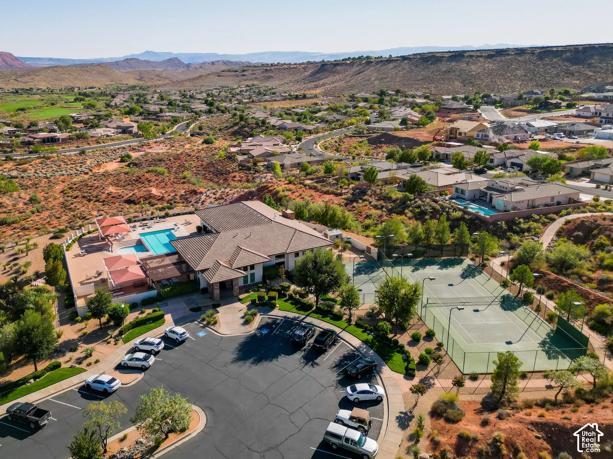 Community amenities featuring a swimming pool, multiple tennis courts, and a club house building