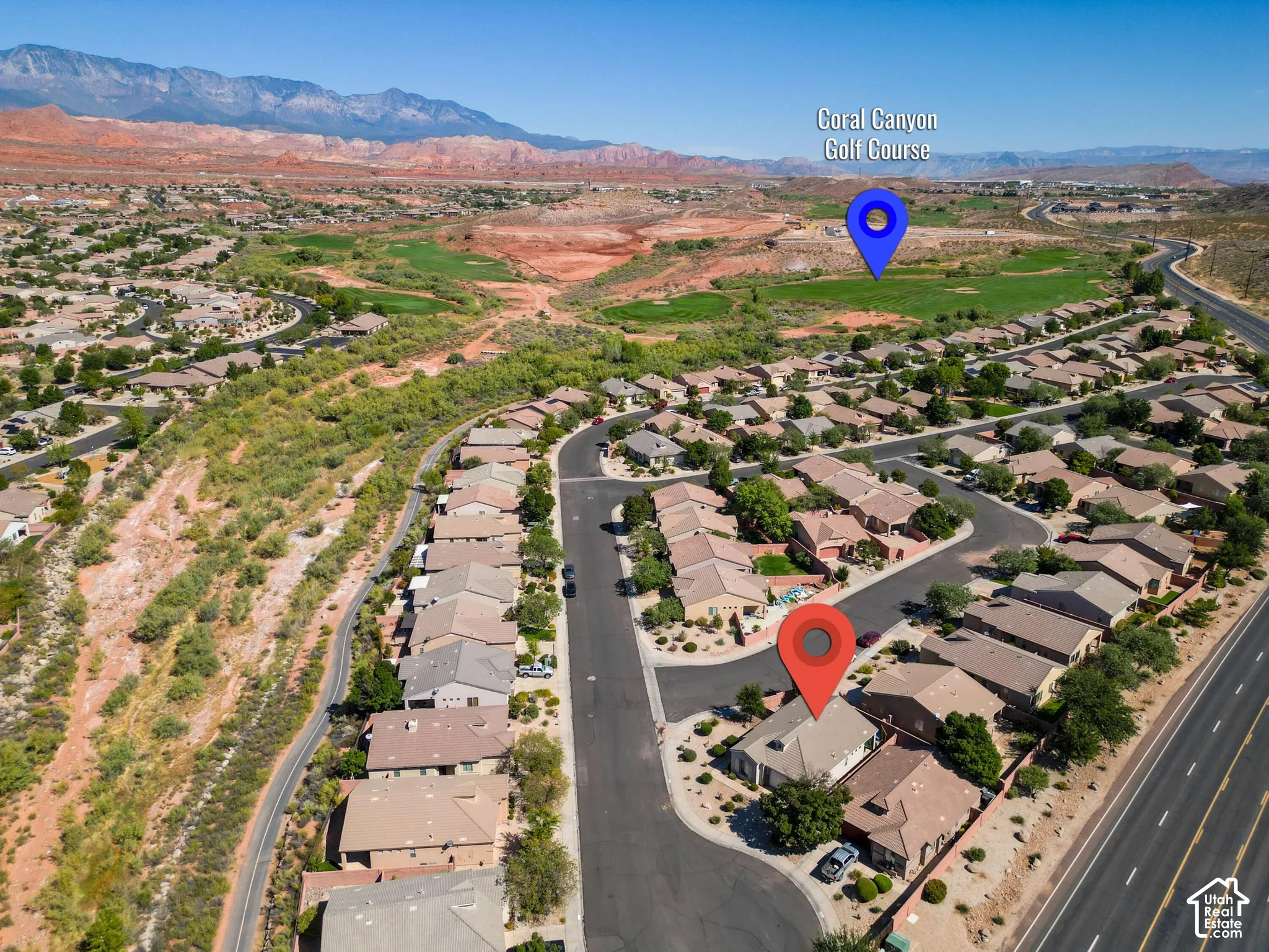 Community setting with desert landscaping and paved roadways