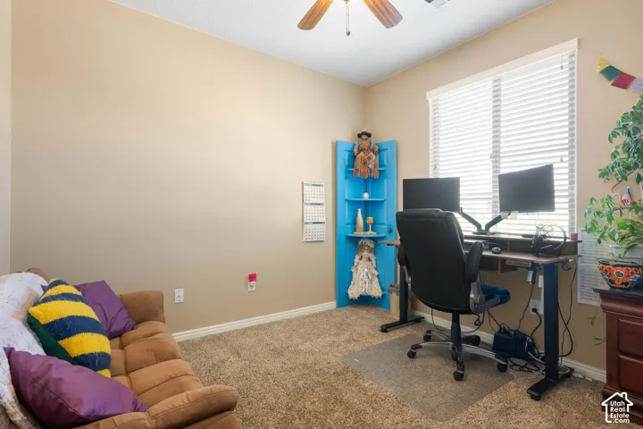 Neutral-toned walls complement the carpeted flooring