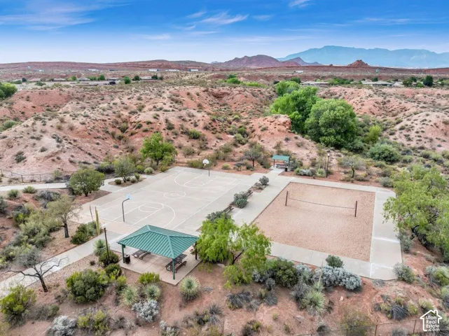 Outdoor basketball court, sand volleyball court, covered picnic area, and paved pathways