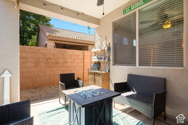 Covered patio with string lighting and ceiling fan