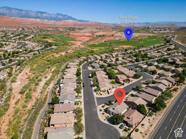 Community setting with desert landscaping and paved roadways