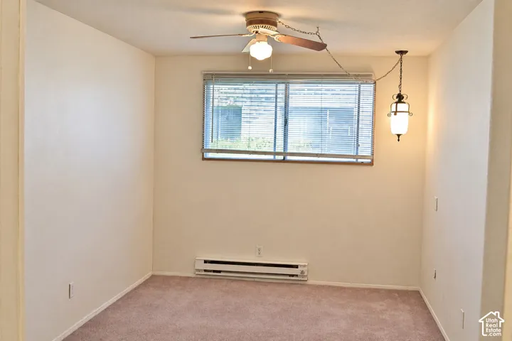 Room with ceiling fan and window