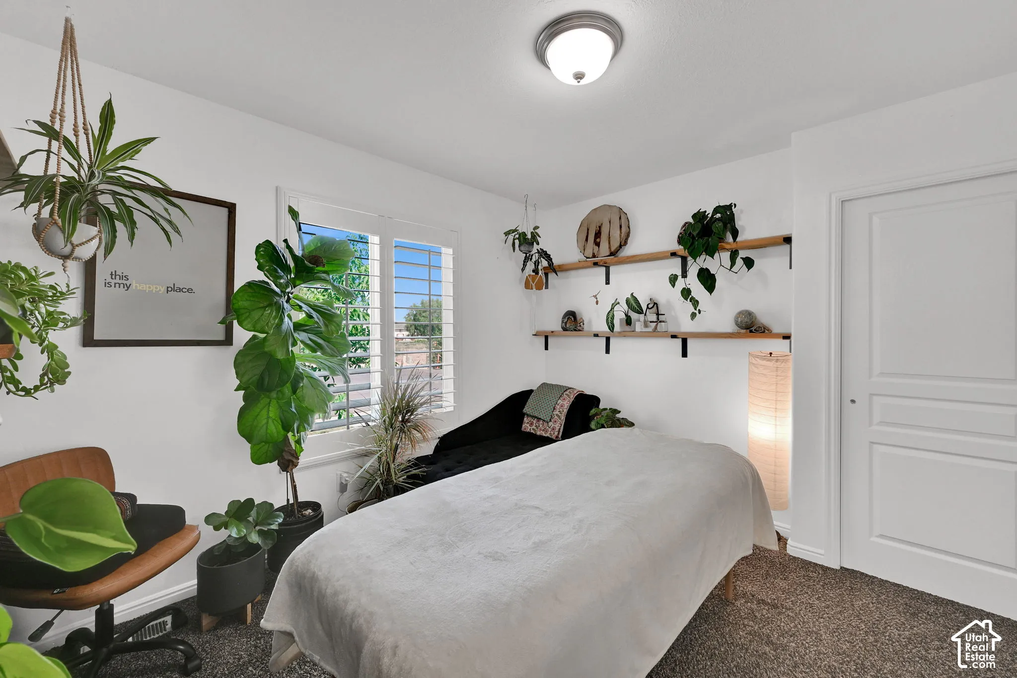 White walls featuring a flush-mount ceiling light and a paneled door