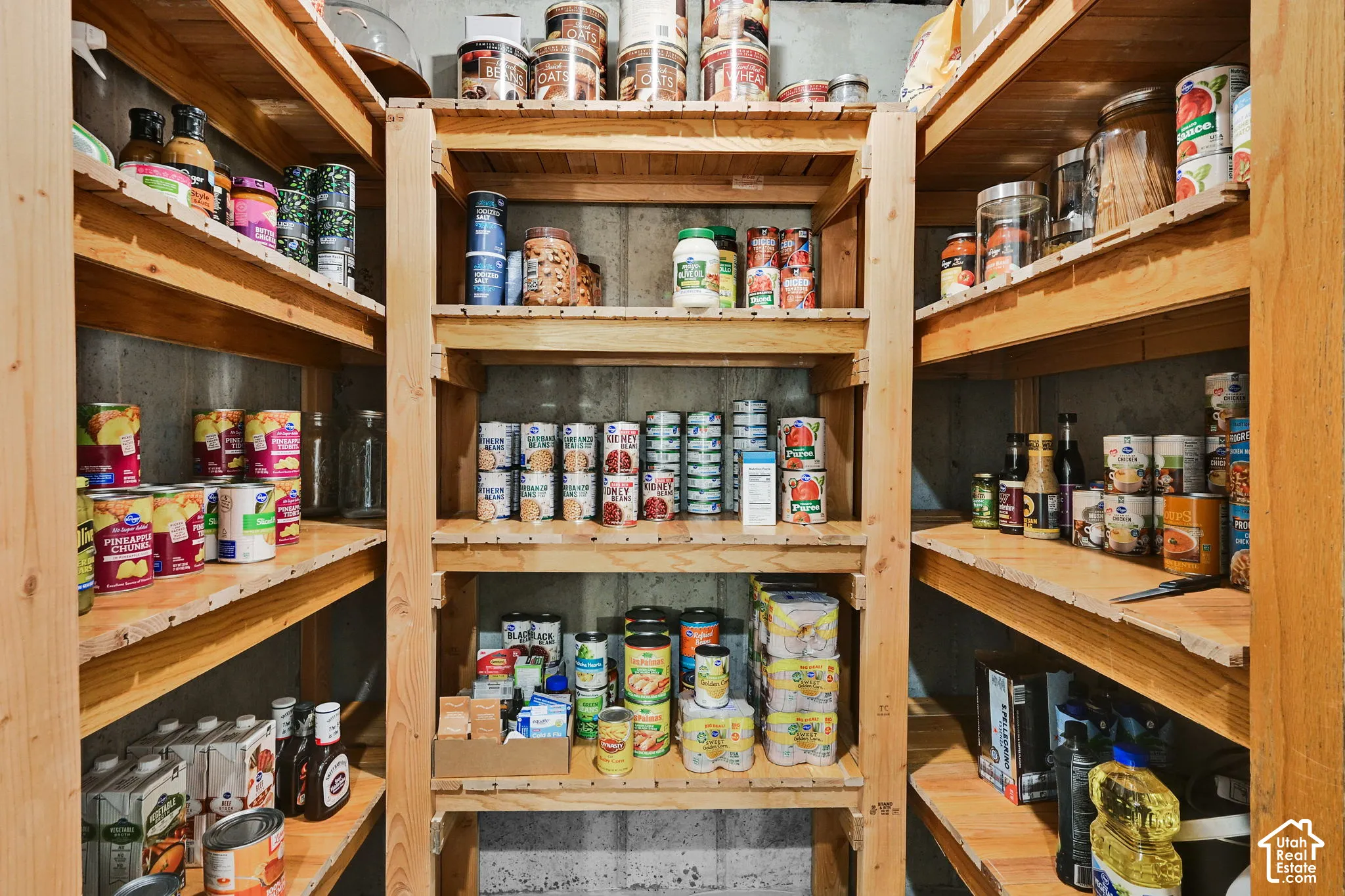 Storage area featuring extensive wood shelving units