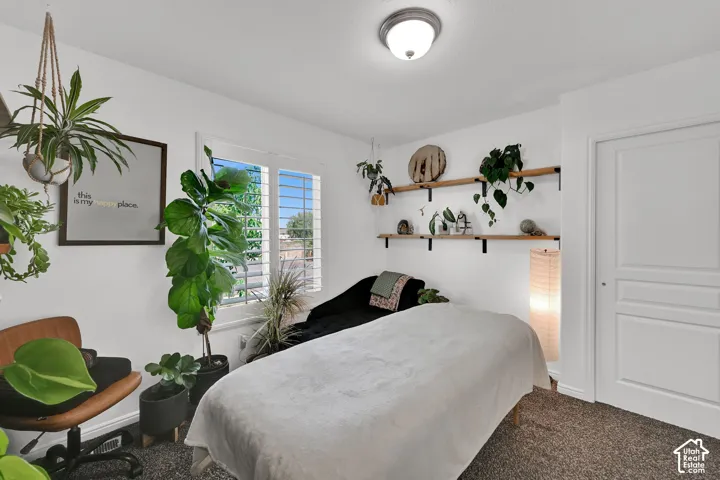 White walls featuring a flush-mount ceiling light and a paneled door