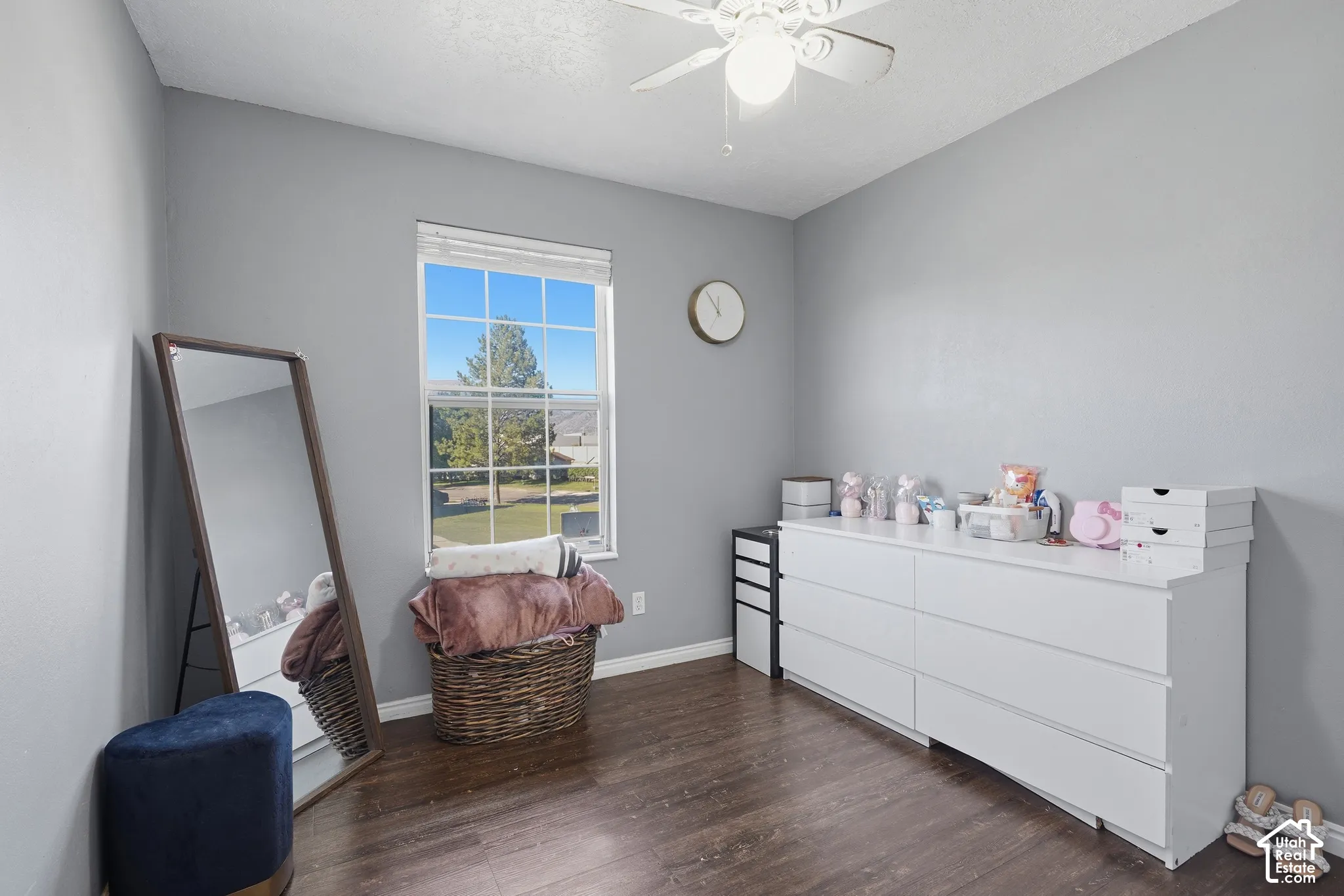 Room featuring wood-finish flooring and a single window