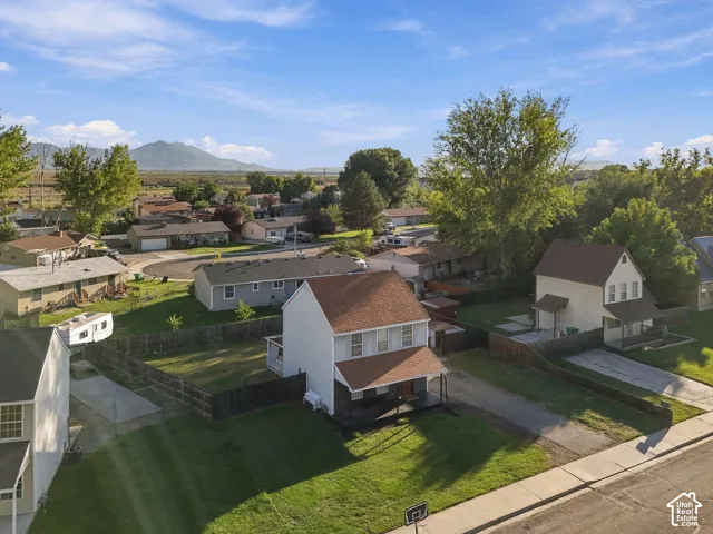 Two-story residence with a covered porch and fenced backyard