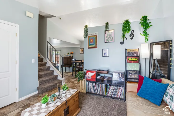 Carpeted staircase with metal balusters