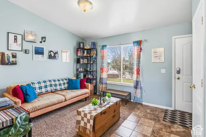 Recessed window, ceiling-mounted light fixture, light blue wall paint, wood-finish flooring, and white trim