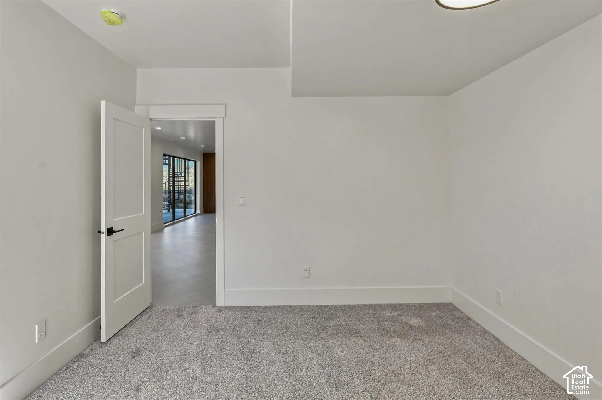 Light gray carpeting with white walls and trim
