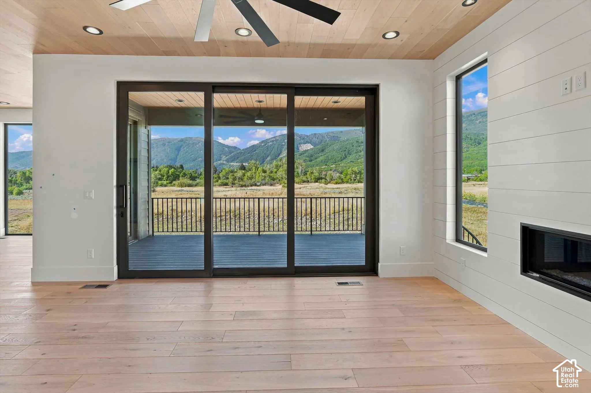 Wood-finish flooring, recessed lighting, and a modern ceiling fan
