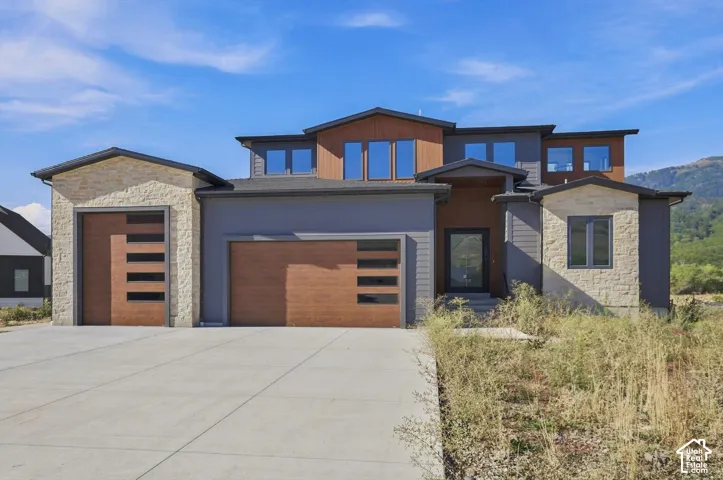 Modern architectural design with stone and wood-finish siding