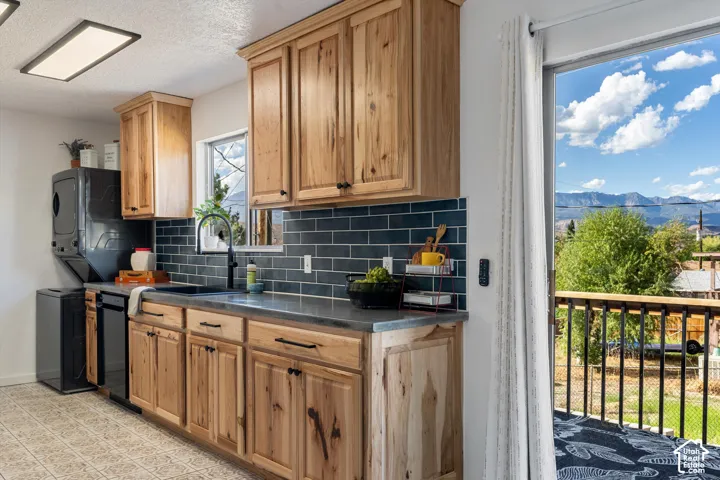 Natural wood cabinetry with black hardware