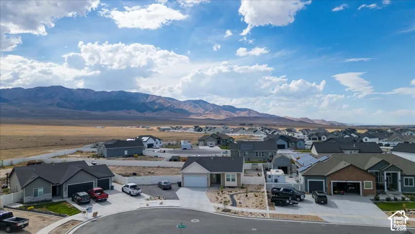 Aerial perspective showcasing a residential community with distant mountains
