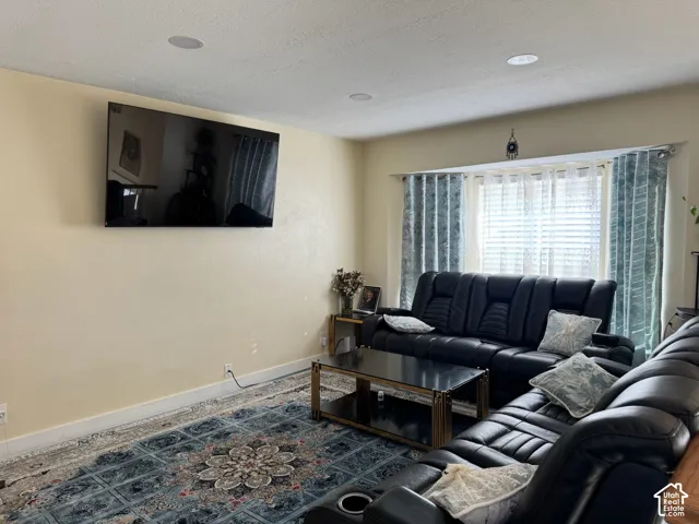 Recessed ceiling lighting illuminates the living area