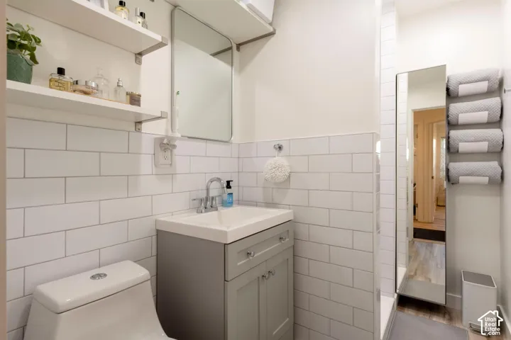 White subway tile wainscoting and shower surround