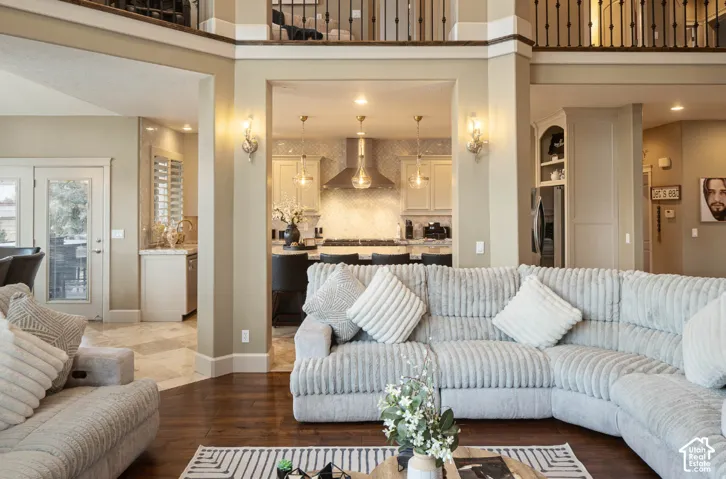 Open-concept living area with dark wood-finish flooring