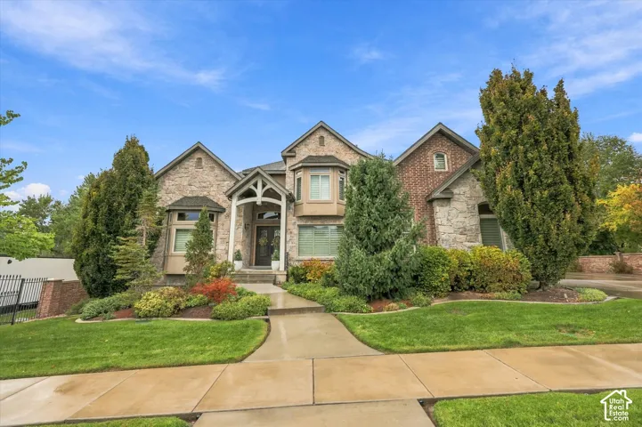 Stone and brick exterior with a prominent arched entry