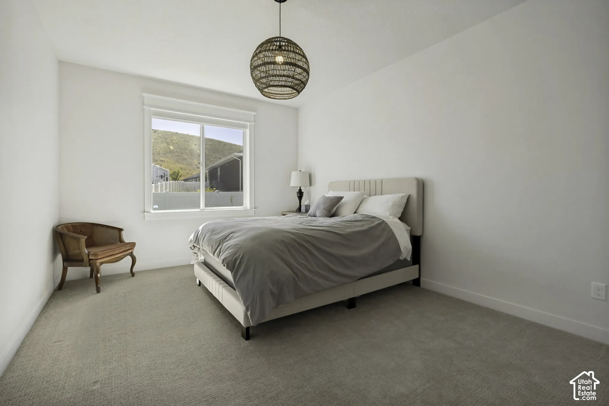 Recessed window framing, neutral wall tones, and carpet flooring