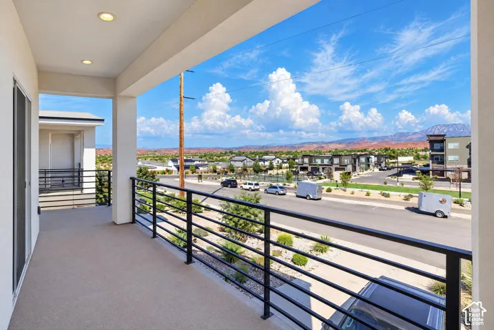 Covered balcony with recessed lighting, offering desert scenery