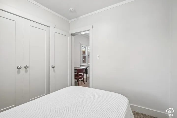 White paneled closet doors with polished chrome hardware