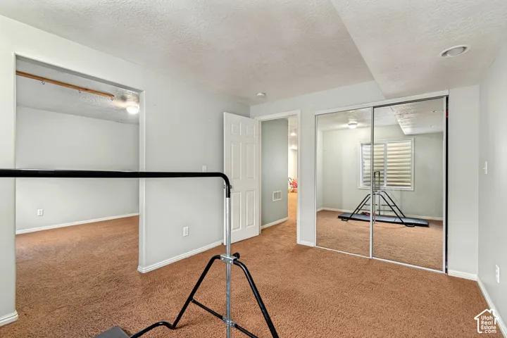 Recessed lighting and a mirrored closet door