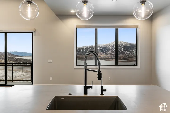 Modern kitchen island with an undermount sink and matte black pull-down faucet