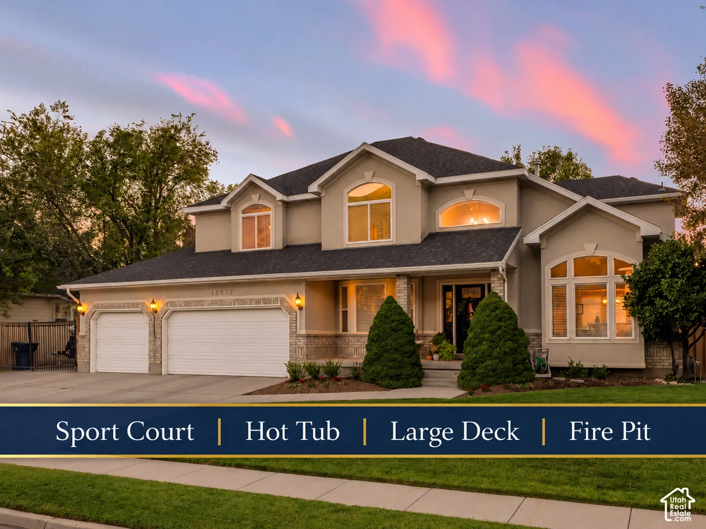 Stucco exterior with stone accents, arched windows, covered entry, and a three-car garage