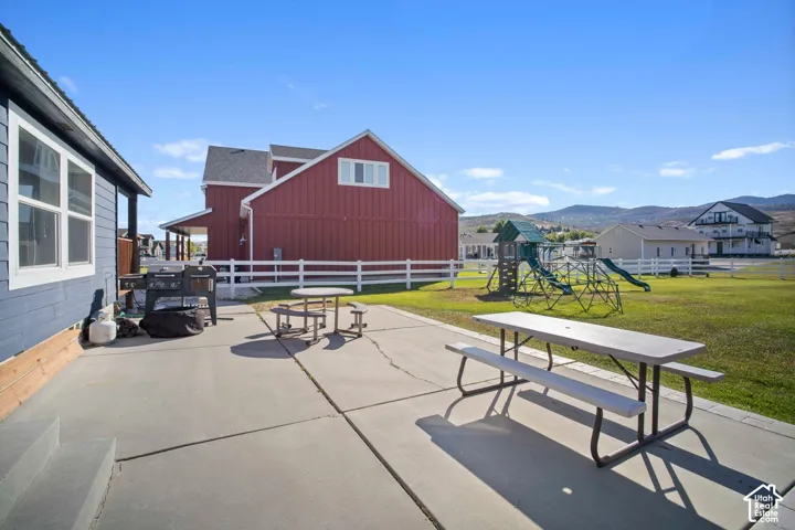 Concrete patio with direct access to a grassy area
