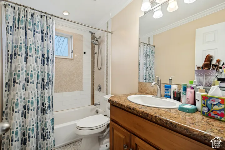 Built-in vanity with a granite-style countertop and an integrated sink