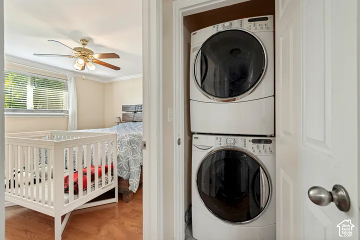 Integrated stacked washer and dryer in a dedicated utility closet
