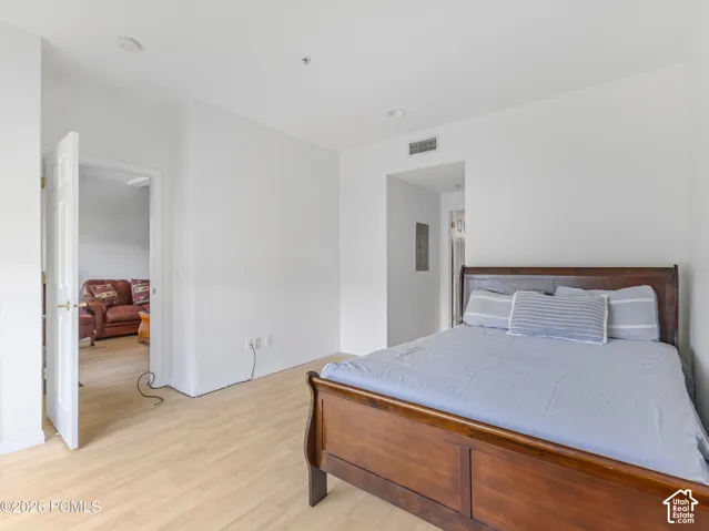 Light wood-finish flooring complements white walls
