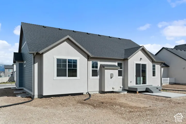 Contemporary exterior with mixed siding and stucco finishes