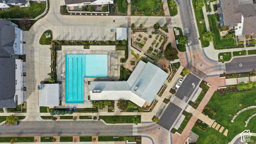 Community swimming pool with dedicated lap lanes and adjacent convenience store and restaurant