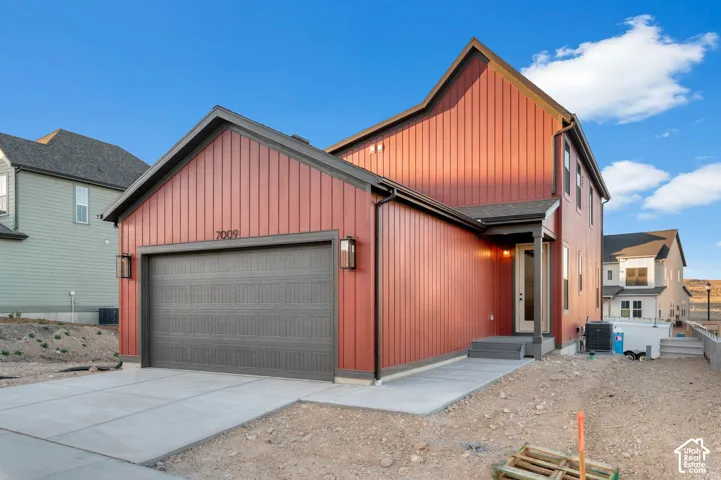 Red vertical siding exterior with dark trim