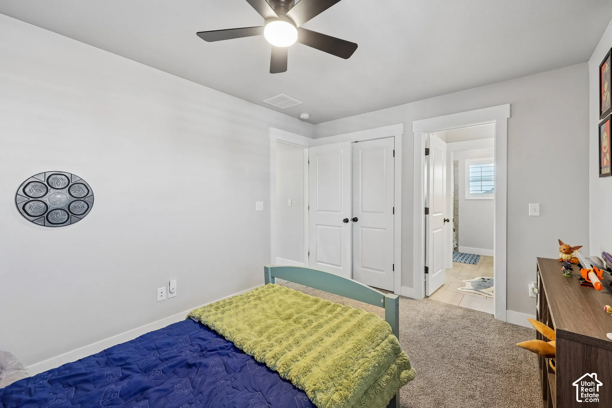 Recessed lighting, ceiling fan, white paneled doors, light grey wall paint, and carpet flooring