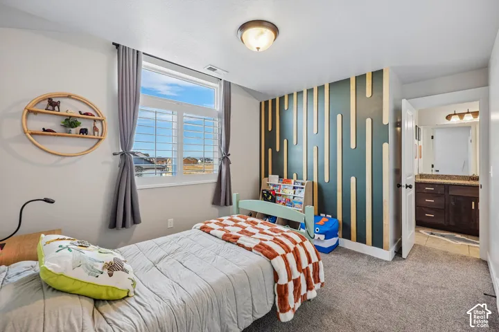 Interior space featuring carpeting, a prominent window with shutters, and a unique accent wall with vertical wood elements