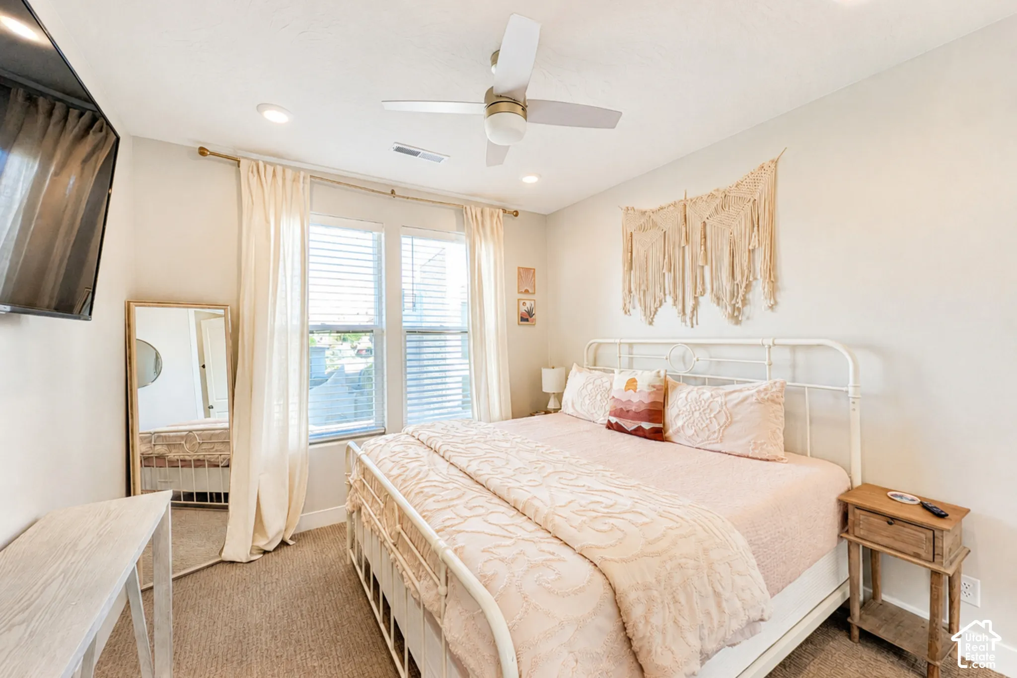 Recessed lighting, ceiling fan, carpeting, and double windows with blinds