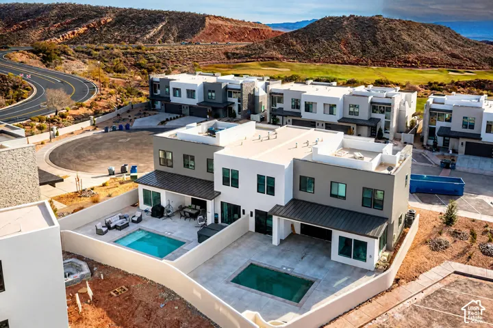 Modern multi-level exterior with a flat roof, private courtyard, and integrated pool