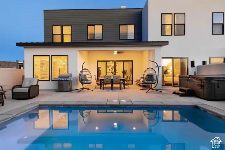 Modern exterior with a swimming pool and hot tub