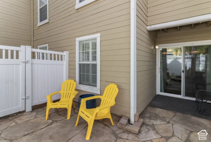 Private outdoor patio with flagstone paving and an adjacent sliding glass door