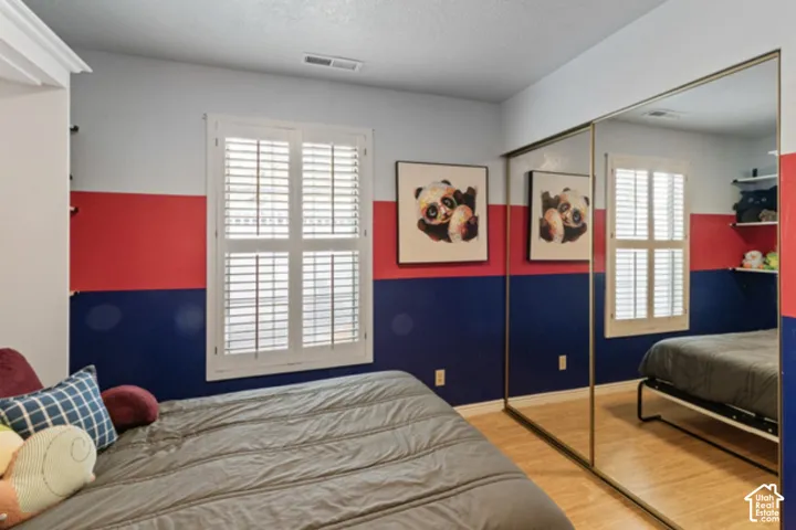 Window featuring white plantation shutters