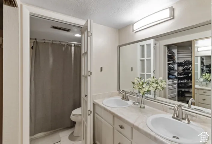 Dual vanity with undermount sinks and brushed nickel faucets