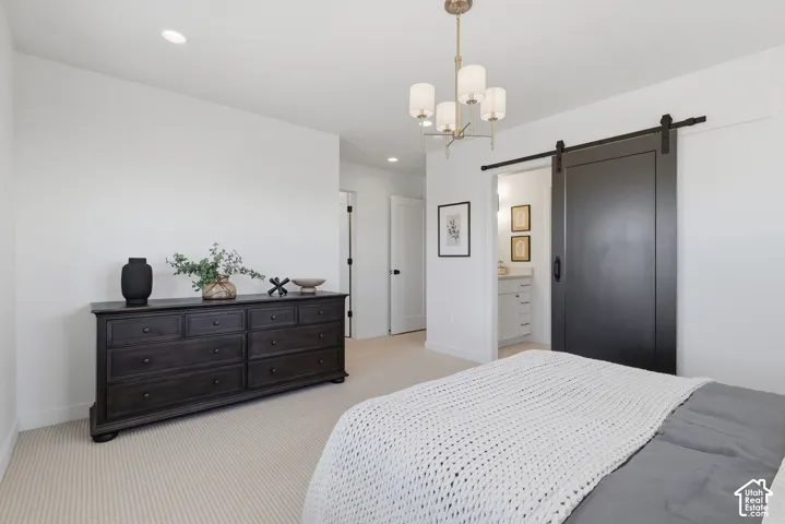 Recessed lighting, chandelier, and a carpeted floor