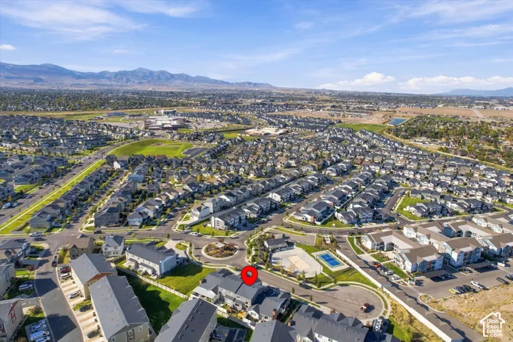 Expansive residential development featuring extensive housing, established infrastructure, and distant mountain scenery