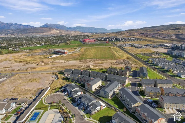 Townhome community with mountain scenery, an on-site tennis court, and manicured green spaces